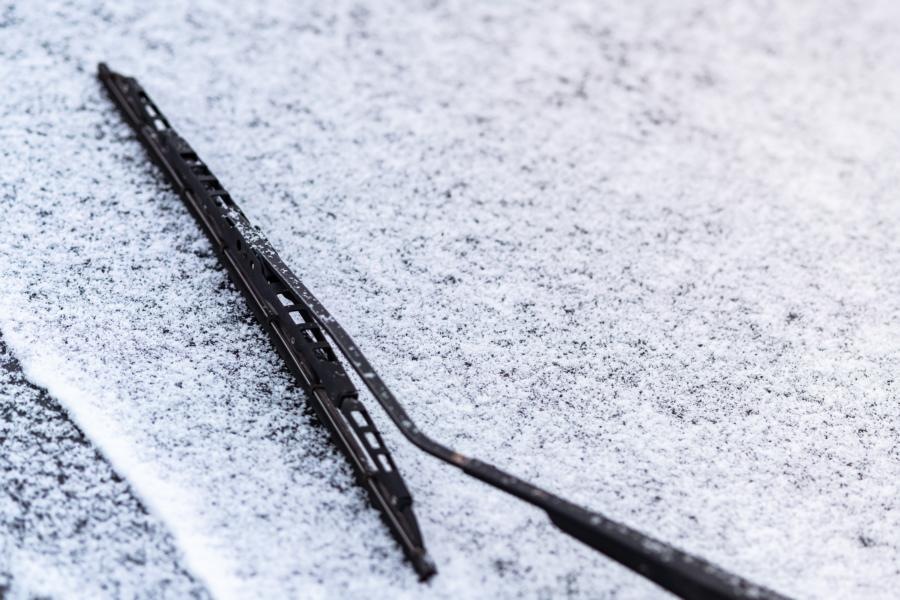 snow covered car and wiper