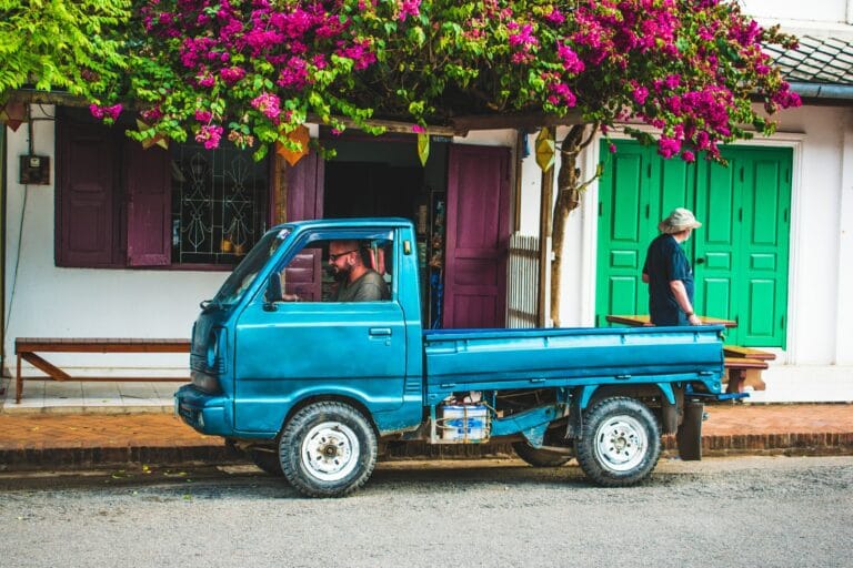 man driving mini truck